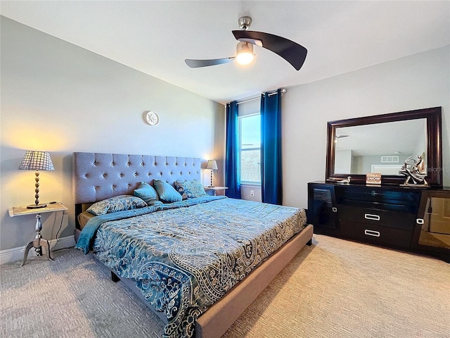 bedroom with ceiling fan and light colored carpet