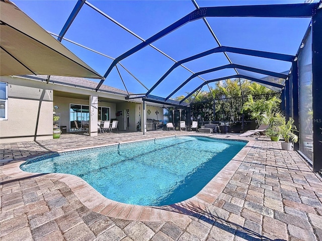 view of swimming pool with a lanai and a patio