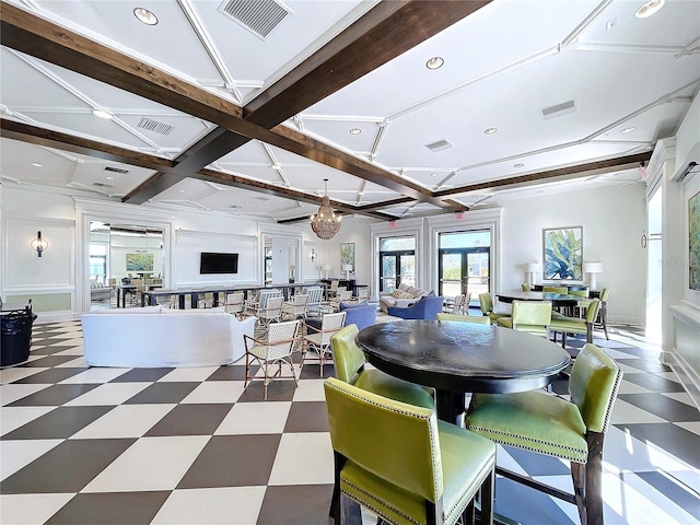 dining room featuring beamed ceiling and coffered ceiling