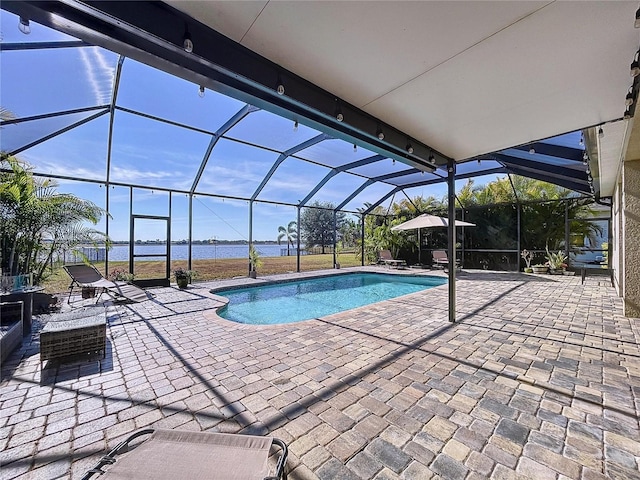 view of swimming pool with a water view, a lanai, and a patio