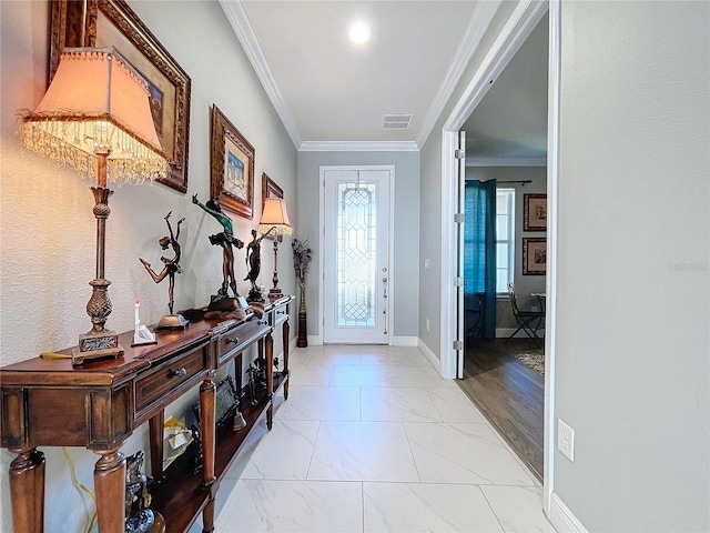 entrance foyer featuring crown molding