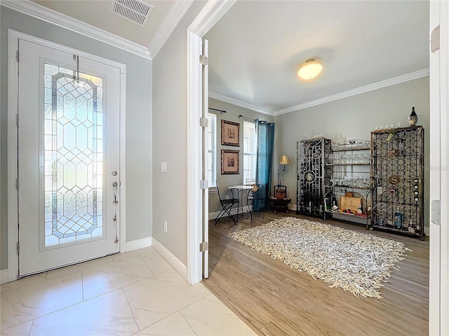 entryway featuring crown molding