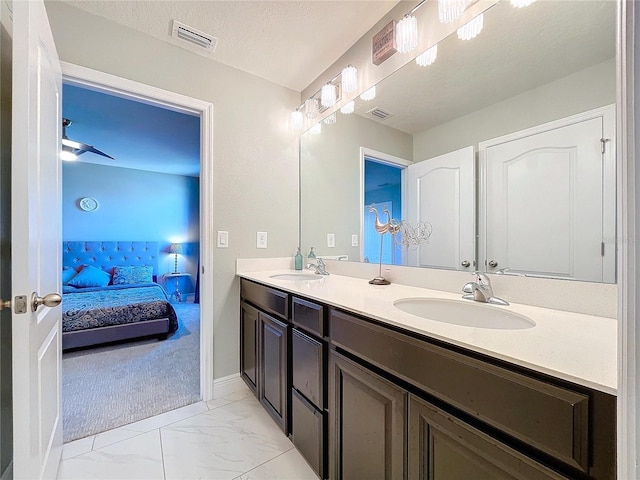 bathroom featuring vanity and a textured ceiling