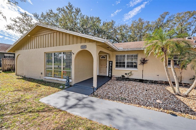 ranch-style home with a front lawn