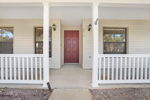 property entrance featuring covered porch