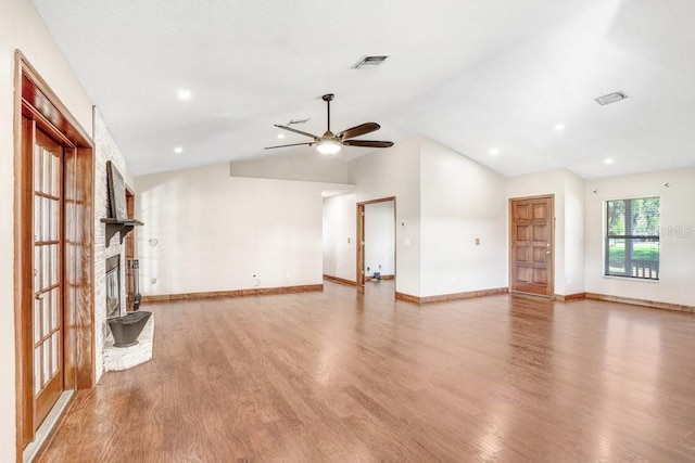 unfurnished living room with ceiling fan, vaulted ceiling, and hardwood / wood-style floors