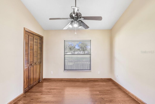 interior space with ceiling fan, hardwood / wood-style floors, and a closet