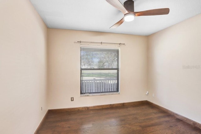 unfurnished room with dark wood-type flooring and ceiling fan