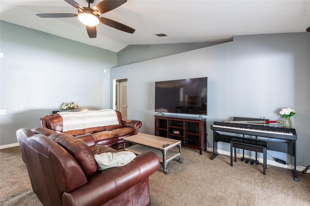 carpeted living room featuring ceiling fan and vaulted ceiling