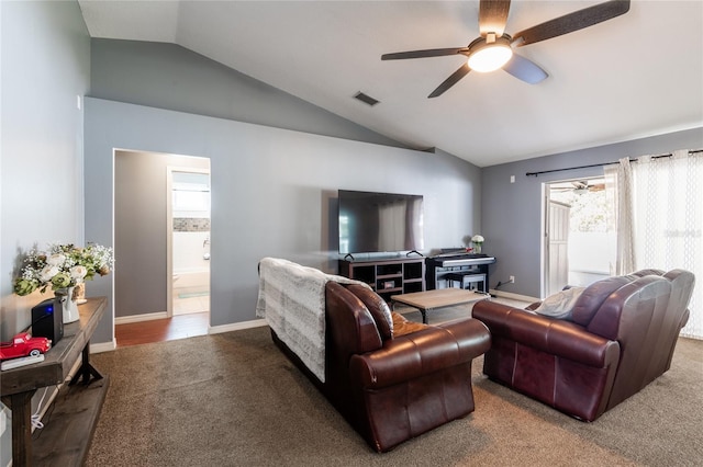 carpeted living room featuring vaulted ceiling and ceiling fan