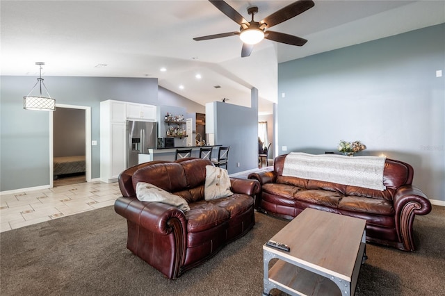 carpeted living room featuring vaulted ceiling and ceiling fan