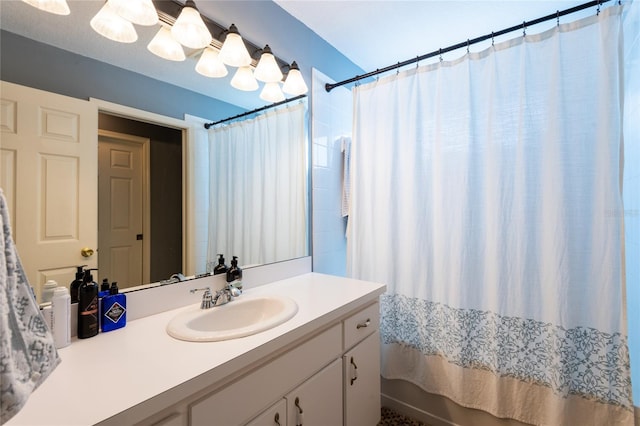 bathroom with vanity and shower / bath combo with shower curtain