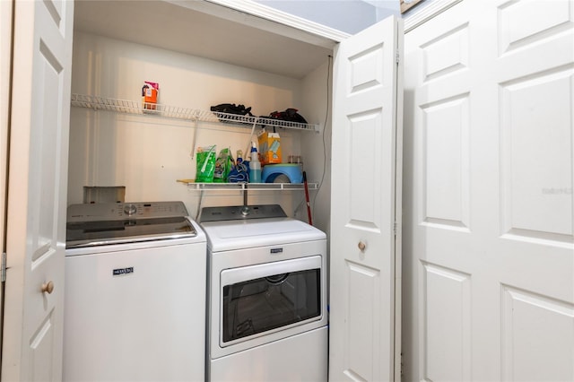 laundry area featuring washing machine and clothes dryer