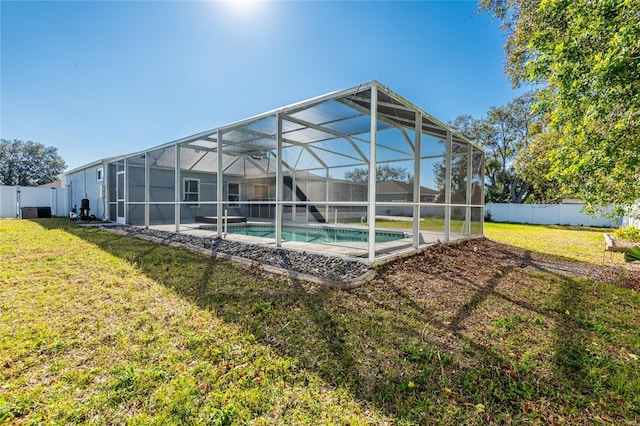 view of swimming pool with a patio area and a lawn