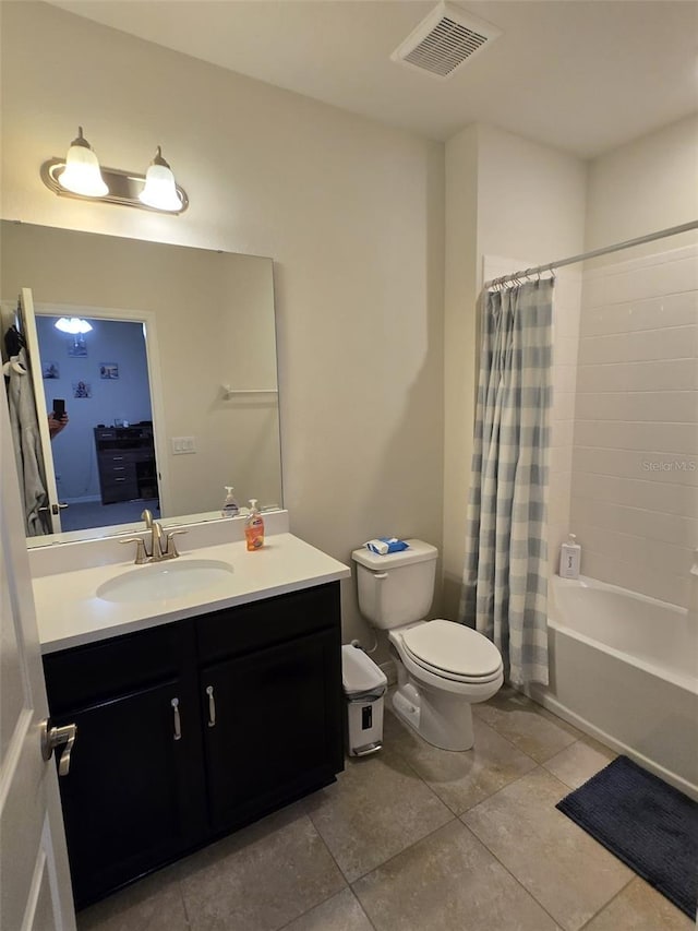 2878 Grand Kemerton Pl, Tampa, FL 33618 - full bathroom featuring tile patterned floors, vanity, toilet, and shower / bath combo with shower curtain