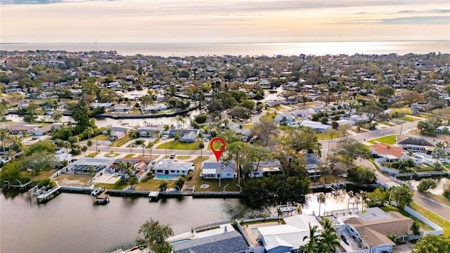 aerial view at dusk with a water view