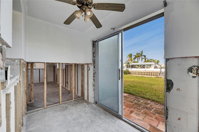 interior space with ceiling fan