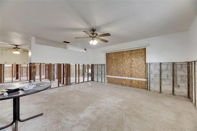 spare room with ceiling fan and a textured ceiling