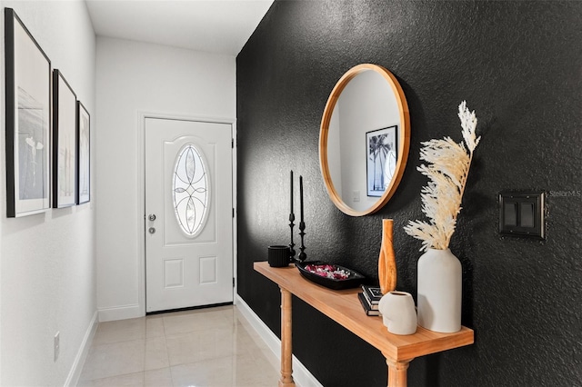 foyer with light tile patterned floors