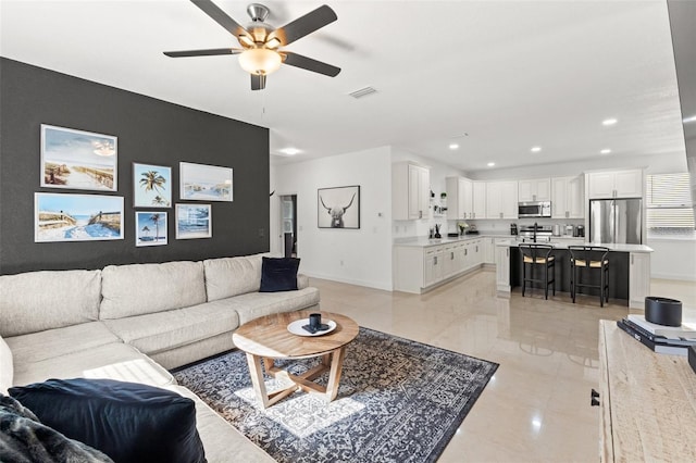 living room featuring ceiling fan