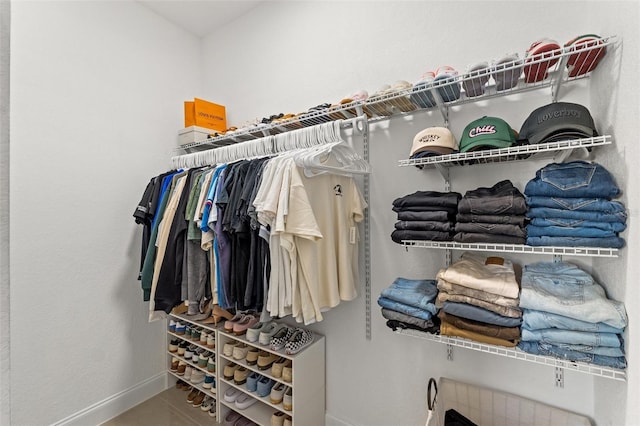 spacious closet with tile patterned floors