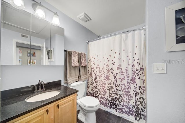 bathroom with a shower with curtain, vanity, toilet, and tile patterned flooring