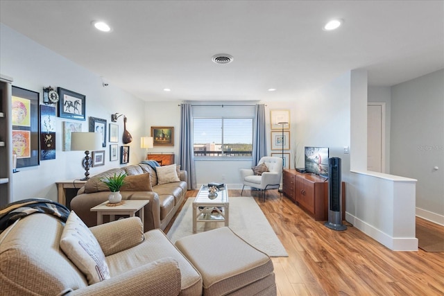 living room with light hardwood / wood-style floors