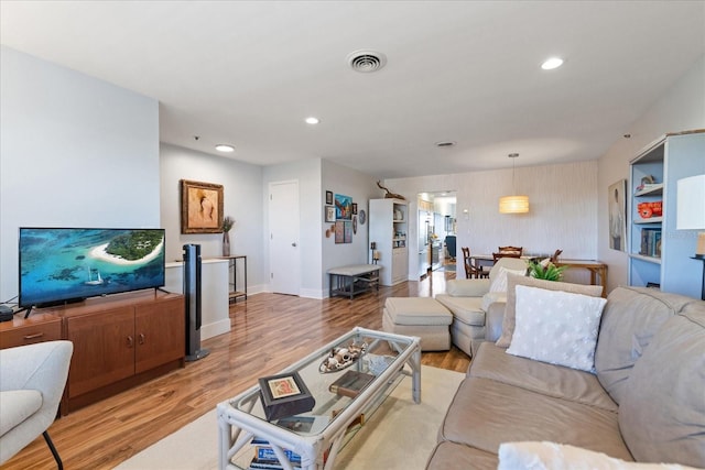 living room with light hardwood / wood-style flooring