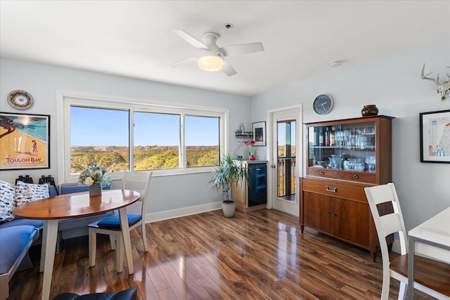 dining area featuring dark wood-type flooring and ceiling fan