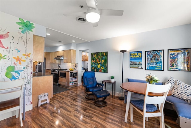 dining area with ceiling fan, dark hardwood / wood-style flooring, and breakfast area