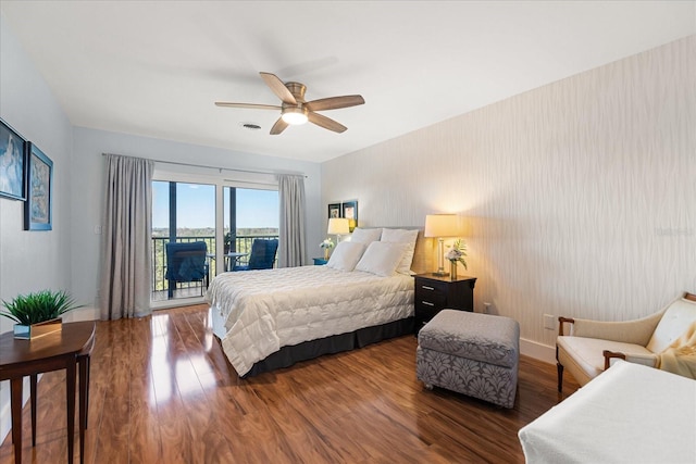 bedroom featuring dark wood-type flooring, access to outside, and ceiling fan