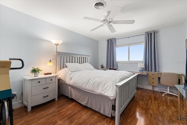 bedroom with dark hardwood / wood-style floors and ceiling fan