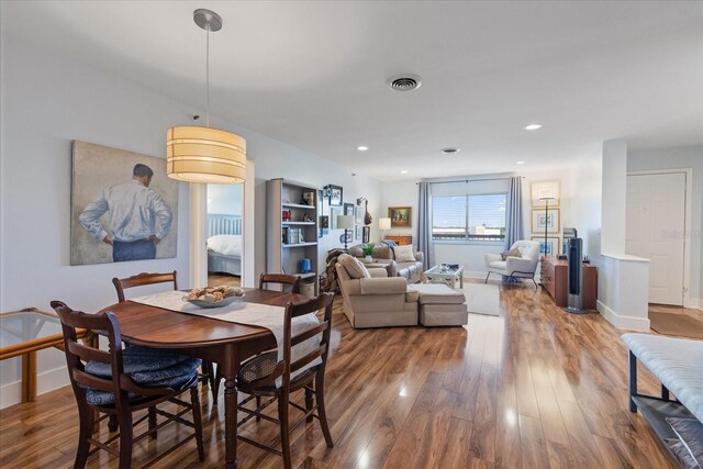 dining space featuring hardwood / wood-style flooring