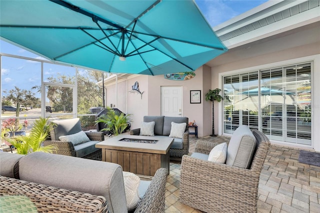 view of patio / terrace featuring an outdoor living space with a fire pit