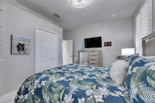 bedroom featuring visible vents