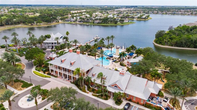 birds eye view of property with a water view and a residential view