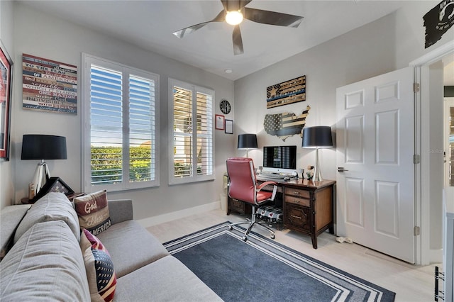 office featuring ceiling fan and baseboards