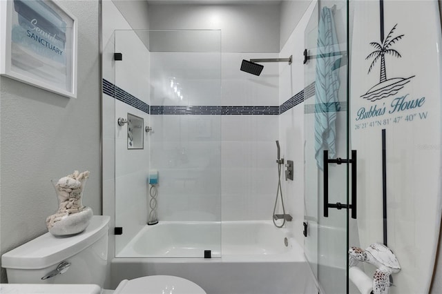 full bathroom featuring a textured wall, shower / bath combination, and toilet