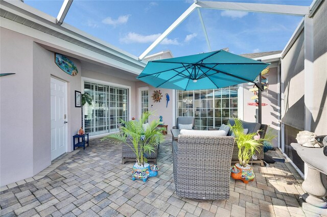 view of patio / terrace featuring a lanai