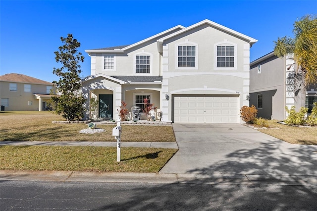 view of front property with a garage and a front yard