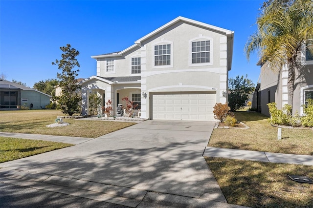 view of front property with a garage and a front lawn