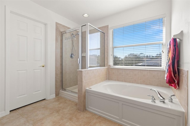 bathroom featuring shower with separate bathtub and tile patterned floors