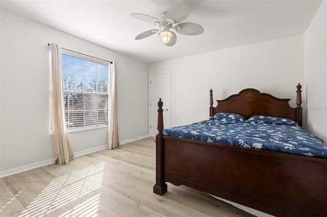 bedroom featuring ceiling fan and light hardwood / wood-style flooring