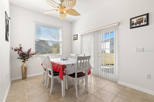 tiled dining area with ceiling fan