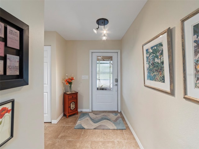 foyer featuring light tile patterned floors