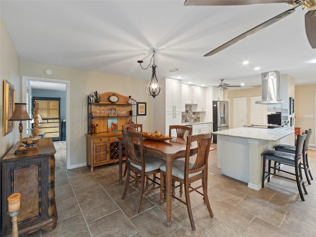 dining space with ceiling fan