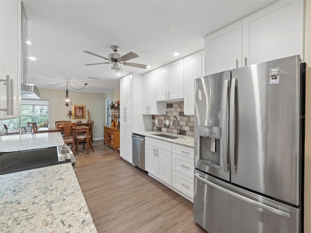 kitchen featuring white cabinetry, appliances with stainless steel finishes, and sink