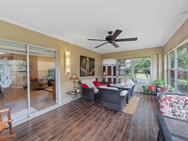 sunroom featuring ceiling fan