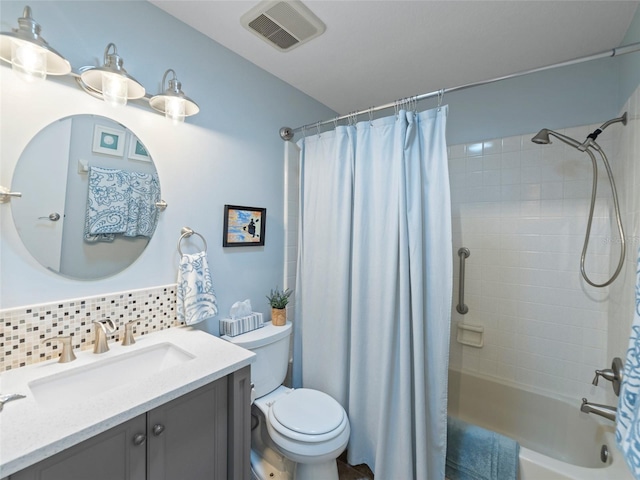 full bathroom featuring tasteful backsplash, vanity, toilet, and shower / tub combo with curtain