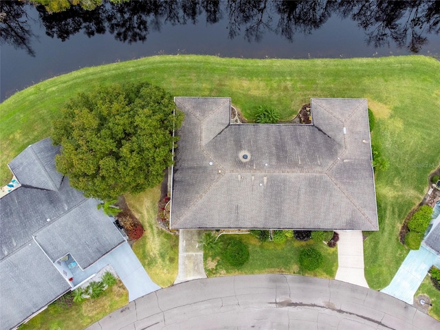 birds eye view of property with a water view